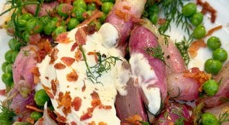 Butter glazed radish with peas and dill